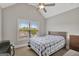 This bedroom features carpeted floors, vaulted ceilings with a ceiling fan, and a large window at 185 Discovery Lake Dr, Fayetteville, GA 30215