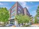 Modern building with brick facade and outdoor restaurant seating area at 185 Discovery Lake Dr, Fayetteville, GA 30215