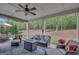 Cozy covered patio with ample seating and a view of the wooded backyard at 185 Discovery Lake Dr, Fayetteville, GA 30215