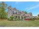 Beautiful two-story home with a well-manicured lawn and lush landscaping at 185 Discovery Lake Dr, Fayetteville, GA 30215