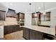 A kitchen with dark cabinetry, stainless steel appliances, and a central island at 185 Discovery Lake Dr, Fayetteville, GA 30215
