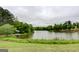 Panoramic view of the serene lake, surrounded by lush greenery, offering a tranquil escape at 185 Discovery Lake Dr, Fayetteville, GA 30215