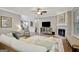 Spacious living room with a fireplace, tv, and neutral decor at 185 Discovery Lake Dr, Fayetteville, GA 30215