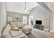 Spacious living room featuring vaulted ceilings and plush couches, with a view into the bathroom at 185 Discovery Lake Dr, Fayetteville, GA 30215