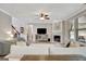 Inviting living room featuring a fireplace, ceiling fan, and hardwood floors at 185 Discovery Lake Dr, Fayetteville, GA 30215