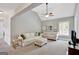 Spacious living room featuring vaulted ceilings, neutral walls, and bright couches at 185 Discovery Lake Dr, Fayetteville, GA 30215