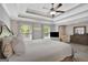 This main bedroom features carpeted floors, neutral walls, a ceiling fan, and window views at 185 Discovery Lake Dr, Fayetteville, GA 30215