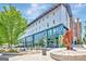 Modern building with art installation, outdoor seating, fountain, and landscaping at 185 Discovery Lake Dr, Fayetteville, GA 30215