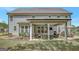 Inviting covered patio with comfortable seating and outdoor dining space at 185 Discovery Lake Dr, Fayetteville, GA 30215