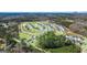 Aerial view of the community showcasing the pool, clubhouse, new homes, and lush landscaping at 1624 Palladian Way # 117, Lithonia, GA 30058