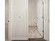 Well-lit bathroom featuring a white shower-tub combo and neutral tile flooring at 1624 Palladian Way # 117, Lithonia, GA 30058