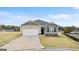Charming single-Gathering home with neutral siding, a two-car garage, and a well-manicured lawn at 1624 Palladian Way # 117, Lithonia, GA 30058