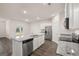 Modern kitchen featuring granite countertops, stainless steel appliances, and white cabinetry at 1624 Palladian Way # 117, Lithonia, GA 30058