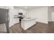 Modern kitchen with granite countertops, a kitchen island, stainless steel appliances and vinyl flooring at 1624 Palladian Way # 117, Lithonia, GA 30058