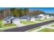 Street view showcasing new homes with manicured lawns along a wide, paved road at 1624 Palladian Way # 117, Lithonia, GA 30058
