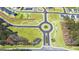 Aerial view of community streets with roundabout and landscaped common areas at 1626 Palladian Way # 118, Lithonia, GA 30058