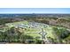 An aerial view of the Champions Run neighborhood showing homes, landscaping, and proximity to nature at 1626 Palladian Way # 118, Lithonia, GA 30058