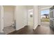 Welcoming entryway with hardwood floors, bathroom access, and view of the home's exterior at 1626 Palladian Way # 118, Lithonia, GA 30058