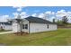 Residential exterior with garage and manicured lawn at 1626 Palladian Way # 118, Lithonia, GA 30058
