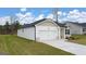 One-story home with a two-car garage, siding, and well-maintained landscaping at 1626 Palladian Way # 118, Lithonia, GA 30058