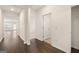 Bright hallway featuring dark wood floors, white walls, and open sight lines into the living space at 1626 Palladian Way # 118, Lithonia, GA 30058