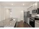 Bright kitchen with granite countertops, stainless appliances, and an island with modern sink at 1626 Palladian Way # 118, Lithonia, GA 30058