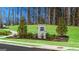 Stone pillar signage surrounded by landscaping at Champions Run at 1626 Palladian Way # 118, Lithonia, GA 30058