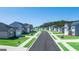 Scenic street view showcasing newly constructed homes with manicured lawns and sidewalks in a suburban neighborhood at 1626 Palladian Way # 118, Lithonia, GA 30058