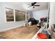 Bedroom with multiple windows bringing in loads of natural light and wood floors at 98 Almon Church Rd, Covington, GA 30014
