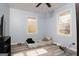Light-filled bedroom with wood-look flooring, perfect for a guest room or home office at 98 Almon Church Rd, Covington, GA 30014