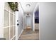 Bright hallway with wood-look flooring, leading to multiple rooms and featuring fresh paint at 98 Almon Church Rd, Covington, GA 30014