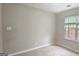 Neutral bedroom features a double window that lets in natural light at 28 Willow Ridge Dr, Hampton, GA 30228