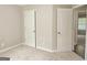 Spacious bedroom with carpeting and two doors at 28 Willow Ridge Dr, Hampton, GA 30228