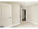 Bedroom features neutral carpet and paint and two doors at 28 Willow Ridge Dr, Hampton, GA 30228