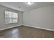 A bright bedroom with hardwood flooring and a window offering plenty of natural light at 28 Willow Ridge Dr, Hampton, GA 30228
