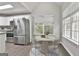Bright dining area with stainless steel appliances, a table setting, and natural light at 28 Willow Ridge Dr, Hampton, GA 30228