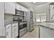 Well-equipped kitchen with stainless steel appliances and updated fixtures at 28 Willow Ridge Dr, Hampton, GA 30228
