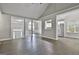 Expansive open-concept living area showcasing hard surface floors and seamless flow to the kitchen at 28 Willow Ridge Dr, Hampton, GA 30228