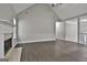 Bright living space featuring a fireplace, hard surface flooring, and contemporary gray walls at 28 Willow Ridge Dr, Hampton, GA 30228