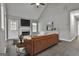 Comfortable living room with vaulted ceilings, a fireplace, and stylish decor at 28 Willow Ridge Dr, Hampton, GA 30228