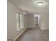 A spacious living room boasting hardwood floors, large windows and great natural light at 28 Willow Ridge Dr, Hampton, GA 30228