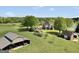 An aerial view showcasing a beautiful home with a barn and backyard gazebo at 39 Gabrielle Ct, Stockbridge, GA 30281