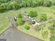 An aerial view showcases a property with lush greenery, a private lake, and spacious grounds at 39 Gabrielle Ct, Stockbridge, GA 30281