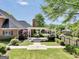Beautiful backyard showcasing a covered patio, lush lawn, and mature trees at 39 Gabrielle Ct, Stockbridge, GA 30281