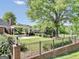 Expansive backyard featuring a pergola, outdoor seating, gazebo, and well-maintained landscaping at 39 Gabrielle Ct, Stockbridge, GA 30281