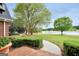 Scenic backyard view of a lake framed by mature trees and manicured landscaping at 39 Gabrielle Ct, Stockbridge, GA 30281