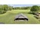 Open-sided barn featuring equipment with a large green lawn at 39 Gabrielle Ct, Stockbridge, GA 30281