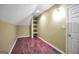 Finished basement with unique built-in shelving, laminate floors, and recessed lighting at 39 Gabrielle Ct, Stockbridge, GA 30281