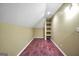 Finished basement with unique built-in shelving, laminate floors, and recessed lighting at 39 Gabrielle Ct, Stockbridge, GA 30281