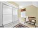 Bright bathroom featuring a tub with sliding glass door and stylish bench with towels and decor at 39 Gabrielle Ct, Stockbridge, GA 30281